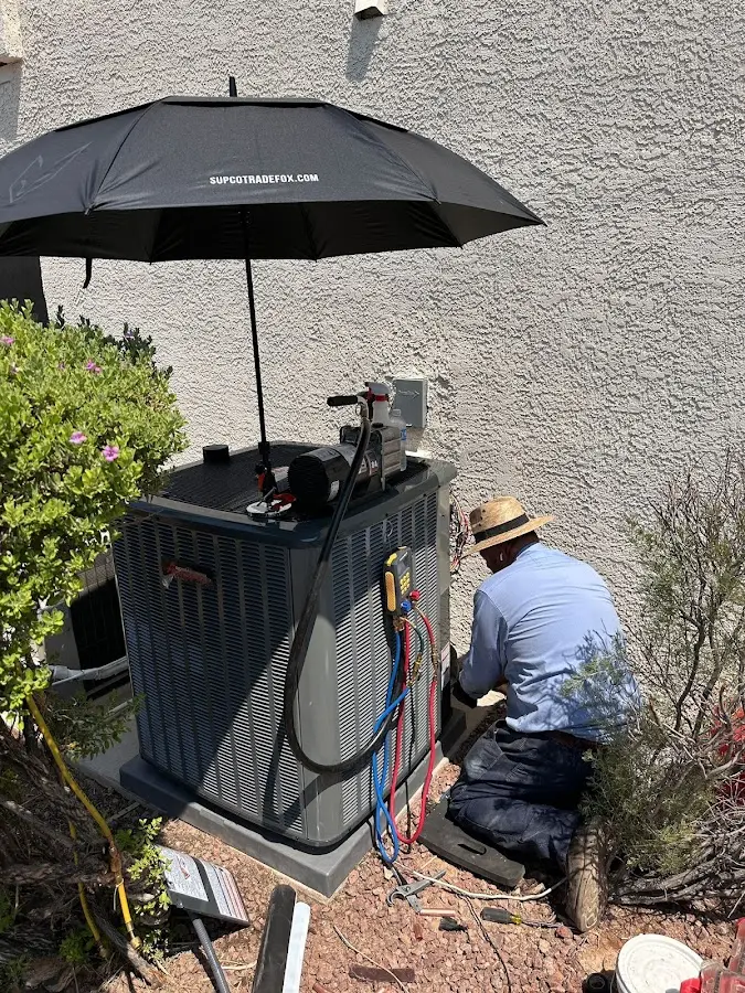 HVAC technician performing outdoor AC maintenance in Meridian
